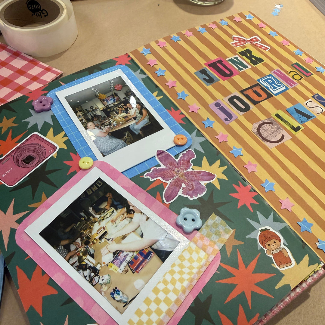 A handmade collage journal page with colorful star patterns, Polaroid photos, stickers, and the text &