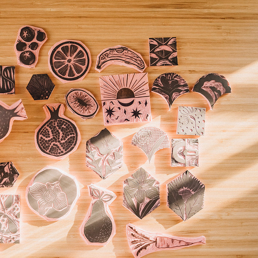 Collection of various rubber stamps on a wooden surface