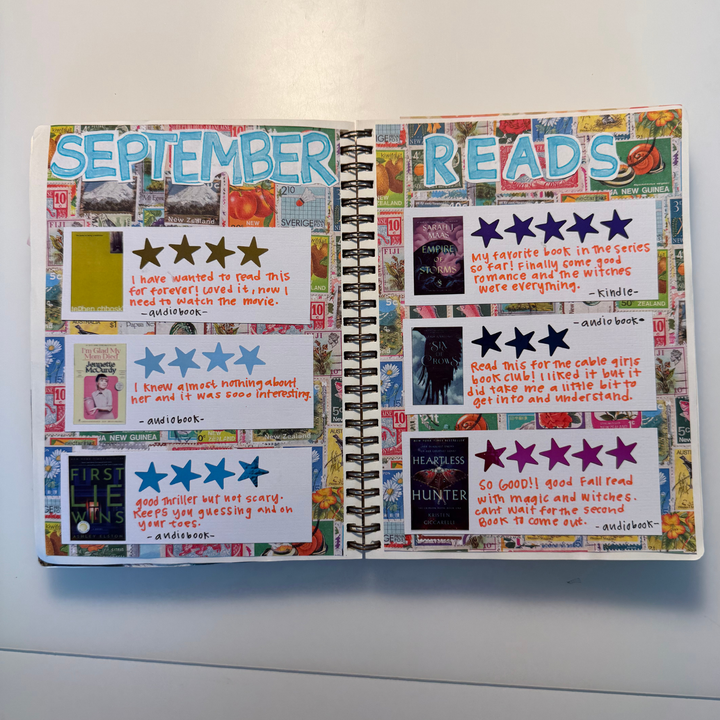 Open notebook with bookstagram-style entries on a white background